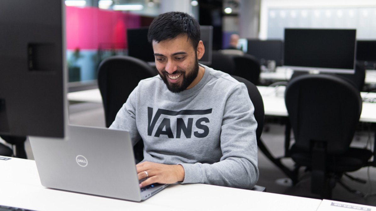 Apprentice using a laptop