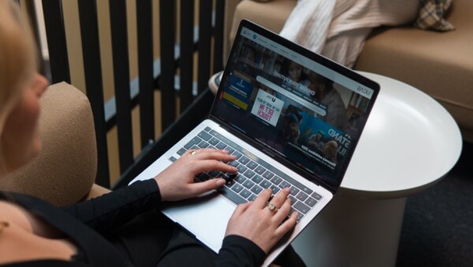 Student using laptop to write personal statement