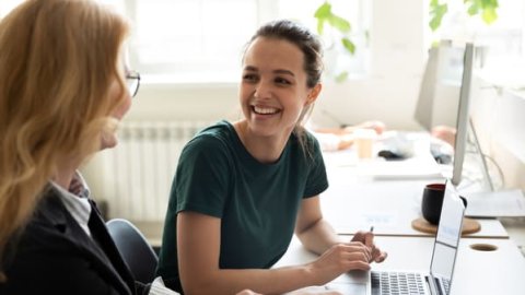 Apprentice chatting to employer