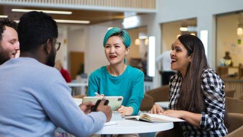 Students chatting in communal area at university