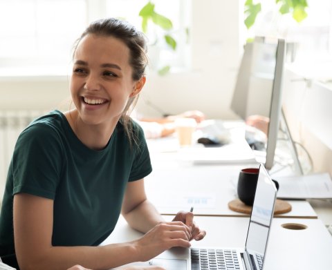 Female apprentice working at computer